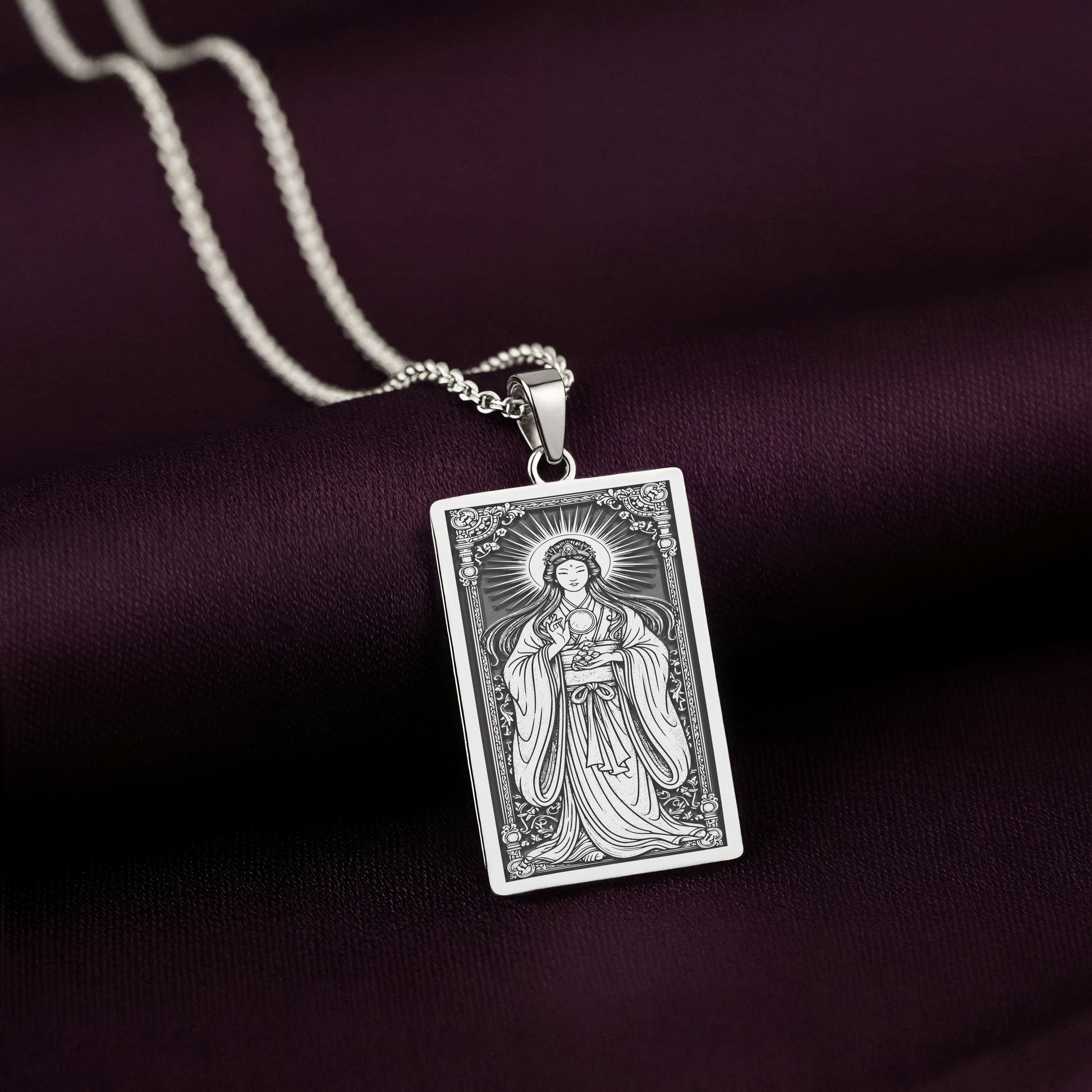 A handcrafted 925 sterling silver Amaterasu charm in a rectangular tarot card shape. This personalized piece of Japan culture jewelry shows the goddess as described in the ancient Kojiki texts.