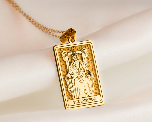 The Emperor tarot card in detailed relief, set against silver, gold, or rose gold. The card shows a figure of authority seated on a throne, surrounded by intricate symbols. It&#39;s a captivating symbol of leadership and stability, perfect for an.