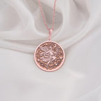 Hermes Medallion Pendant Necklaces 14K Rose 14K 14K Rose Gold Plated winged figure pendant necklace with intricate swirling design