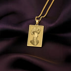 Product photo of a 14K Solid Gold Doberman necklace from the 'Victorian Pet Collection'. The engraved officer portrait is centered clearly on a rich purple satin background.