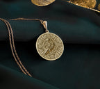 14K Gold Plated Raven Pendant Necklace featuring an Aztec calendar motif. A symbolic gift for mythology fans or history enthusiasts. Stylish and meaningful jewelry for everyday wear or special occasions.