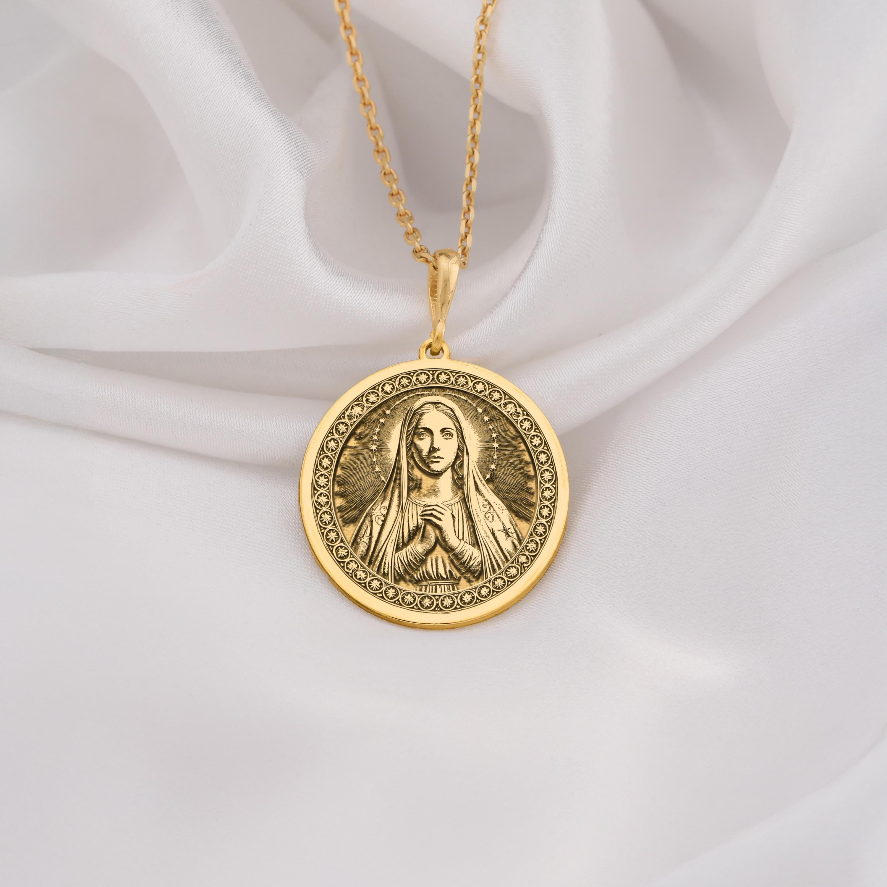 14K Solid Gold Queen of Peace necklace featuring Virgin Mary with halo and praying hands. A sacred and elegant Catholic gold medallion.