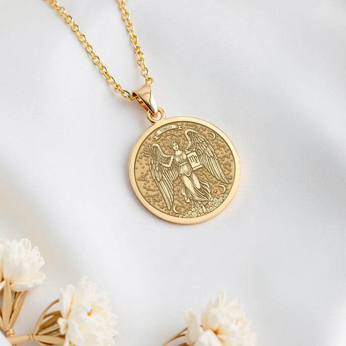A personalized 14K gold plated Virgo medallion. This astrology jewelry is a perfect birthday gift for the practical Earth Sign, born in August or September.
