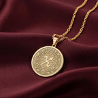 14K Solid Gold Sagittarius Zodiac Medallion with Sagittarius archer symbol (♐) and a laurel wreath border. A perfect personalized gift with optional back engraving. Detailed celestial horoscope jewelry