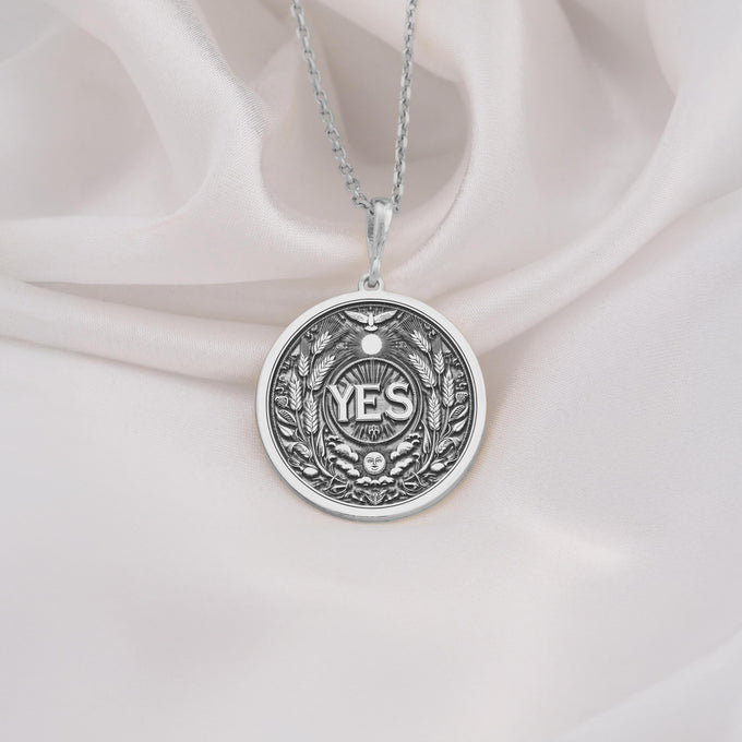 925 Sterling Silver YES Medallion showcasing powerful affirmation with abundance symbols. Detailed positive coin pendant with wheat laurels, sun, moon and bird motifs. Premium empowerment jewelry symbolizing decisiveness and forward momentum.