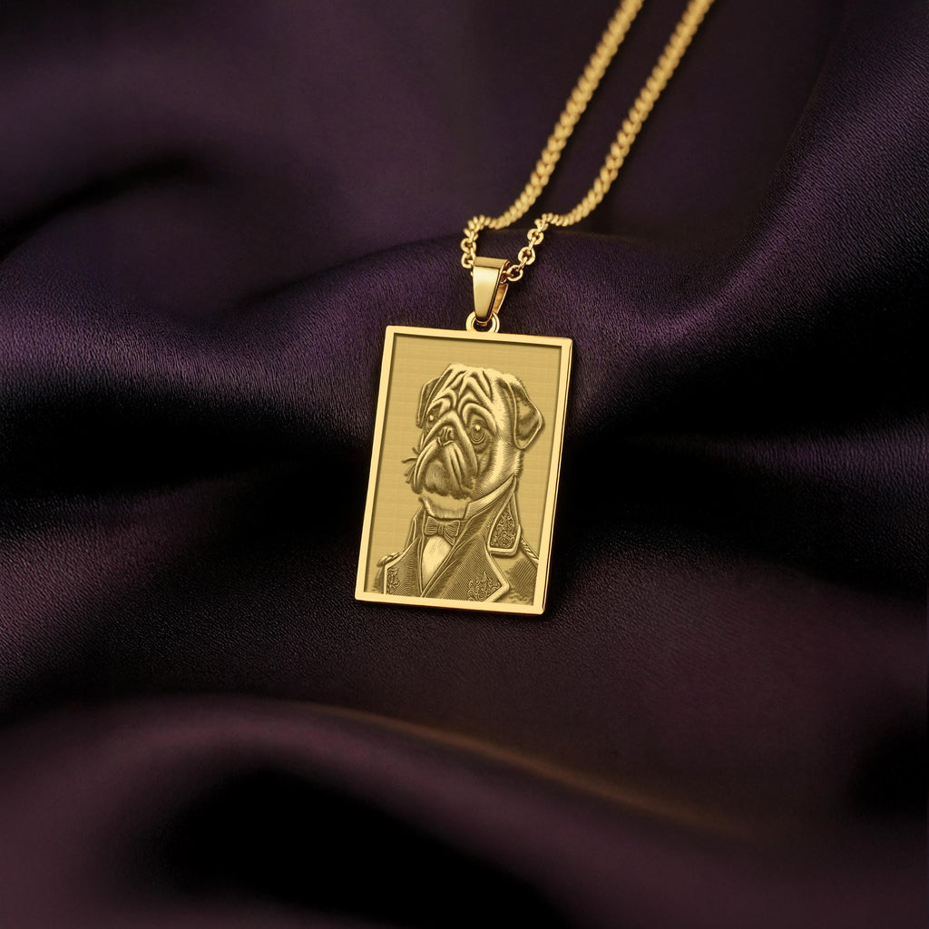 A rectangular 14K gold plated pendant necklace featuring a detailed laser engraving of a distinguished Pug dog in a Victorian suit.