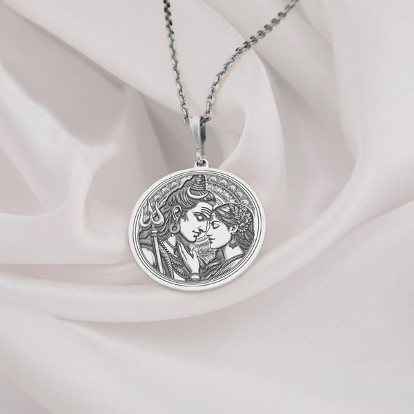 silver lord Shiva and Goddess Parvati pendant necklace, in a loving embrace. The design showcases divine symbols like Shiva s trident and their serene expressions, symbolizing the eternal bond of love and spirituality in Hindu mythology