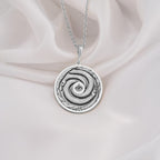 Sterling Silver Ouroboros Necklace crafted with fine details, showcasing the eternal snake symbol of rebirth and cycles. A meaningful gift or statement piece for any occasion.