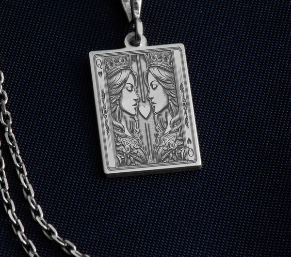 Silver Ace of Queens pendant with two intricately detailed queens and a heart symbol, symbolizing love, pride, and connection. Ideal LGBTQ+ jewelry piece.