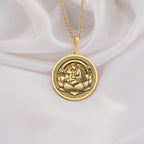 Lotus Mother pendant in 14K solid gold, featuring a divine mother and child engraving on a lotus medallion. This spiritual necklace symbolizes motherhood, love, and enlightenment, making it a perfect gold sacred jewelry piece.
