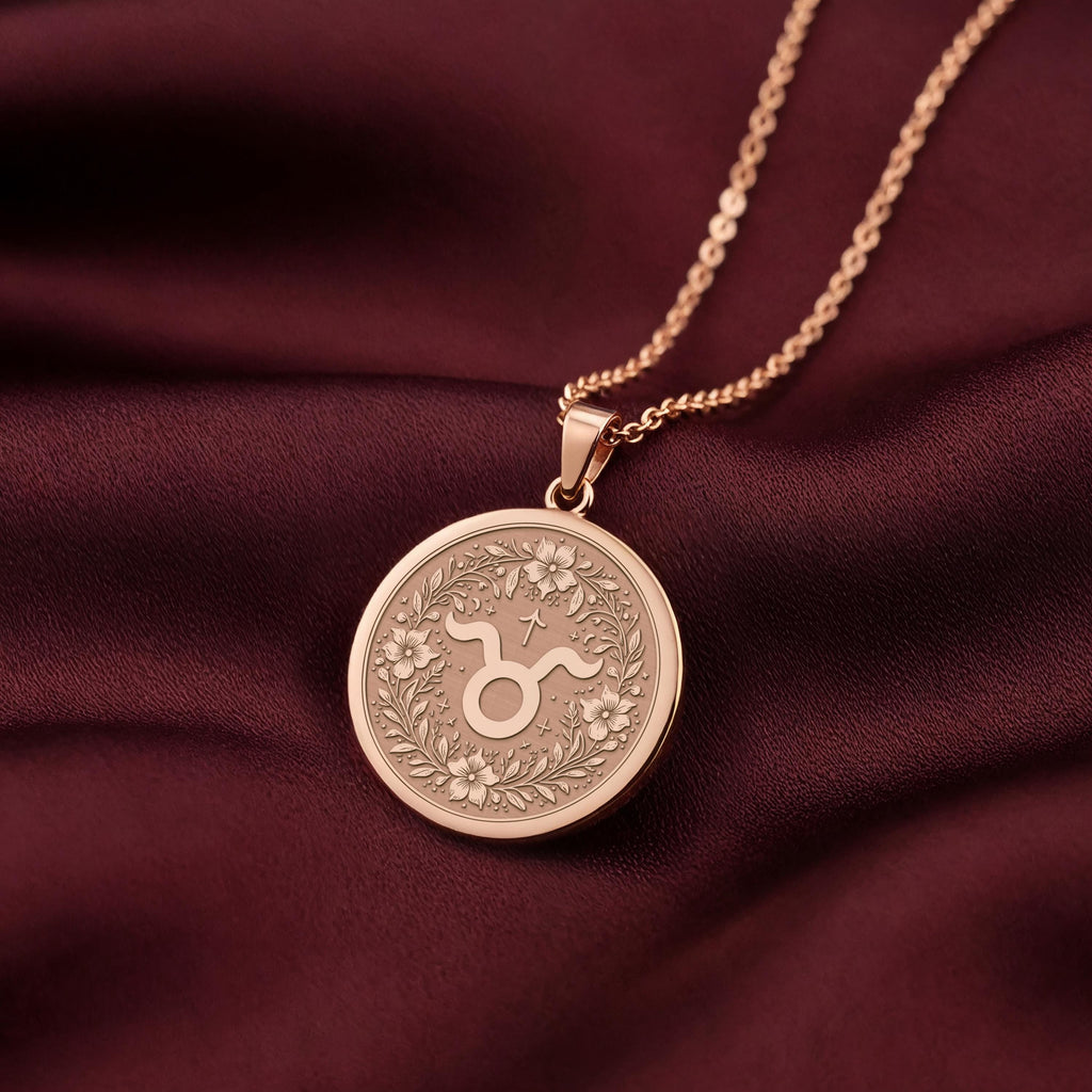 Rose Gold Plated Taurus Zodiac Medallion with an ornate floral border. This warm-toned celestial pendant is customizable with engraving, an elegant horoscope gift representing loyalty.