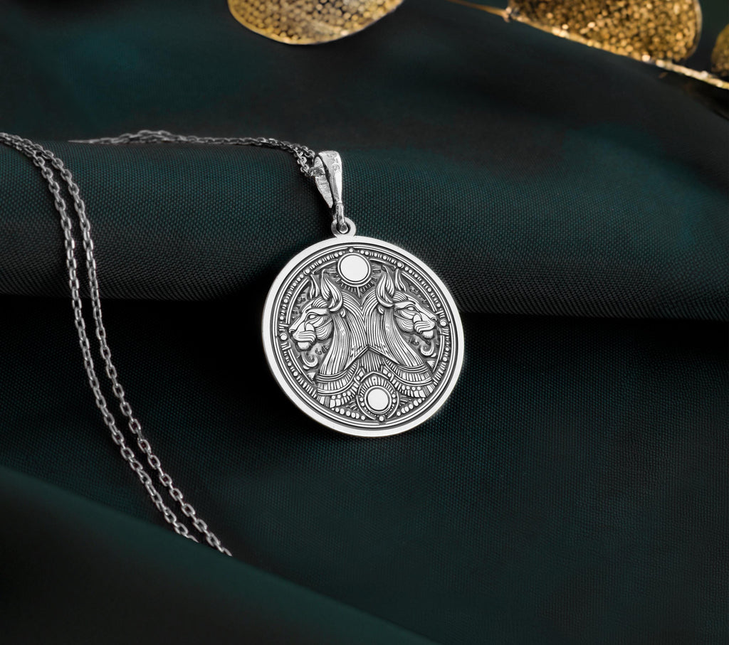 Silver Egyptian Aker necklace with a double lion design. Handmade unisex mythology pendant symbolizing protection and inspired by ancient Egyptian art.