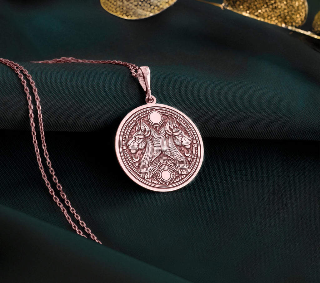 Rose gold plated Egyptian Aker necklace featuring a double lion design. A unique handmade unisex mythology jewelry piece inspired by ancient Egypt.