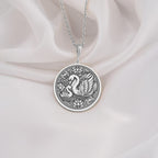 925 Sterling Silver Mother Baby Swan Medallion showcasing protective mother swan with baby cygnet surrounded by ornate elements. Detailed family coin pendant with maternal design. Premium swan jewelry symbolizing family bonds.