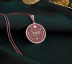 Rose Gold Plated NO Pendant with boundary affirmation design. Warm-toned self-respect medallion with detailed evil eye, moon and botanical motifs. Empowerment jewelry celebrating personal limits and conscious decision-making.