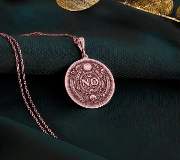 Rose Gold Plated NO Pendant with boundary affirmation design. Warm-toned self-respect medallion with detailed evil eye, moon and botanical motifs. Empowerment jewelry celebrating personal limits and conscious decision-making.