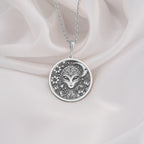 Intricately detailed sterling silver alien pendant, designed with a galactic face surrounded by celestial patterns. A perfect silver cosmic medallion, symbolizing the unknown and interstellar energy.