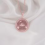 Rose gold plated snow globe pendant featuring two cats in a whimsical coin-style medallion. Handmade and elegant, perfect gift for cat lovers and special occasions.