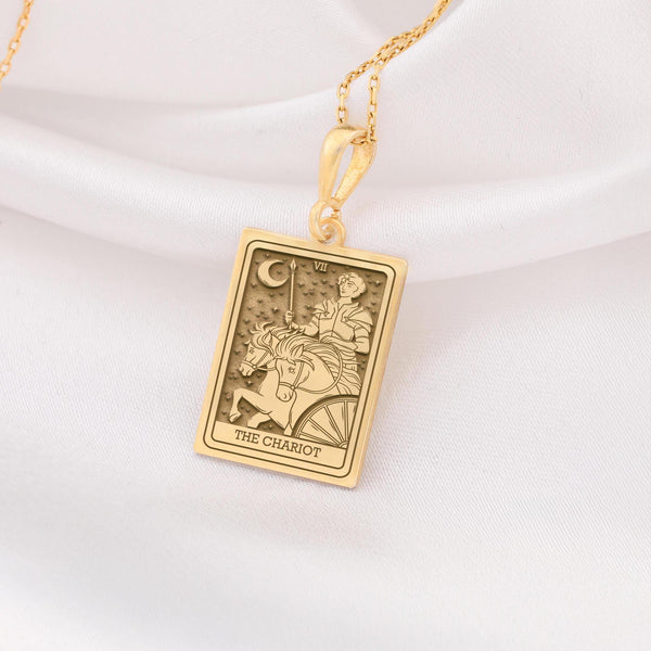 The Chariot Gold Necklace is a stunning piece crafted fromgold plated bass, featuring a detailed tarot charm design. Perfect for tarot enthusiasts, spiritual seekers, or anyone looking for a unique gift, this necklace combines elegance and meaning. It comes with a gold plated stainless steel cable chain, ensuring durability and a luxurious finish. Embrace the energy of The Chariot tarot card with this meaningful jewelry piece, ideal for daily wear or special occasions.