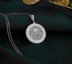 a necklace with a medallion on a chain