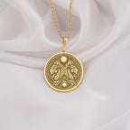 Gold plated Egyptian Aker necklace featuring a double lion design. A unique unisex mythology pendant symbolizing protection and inspired by ancient Egypt.