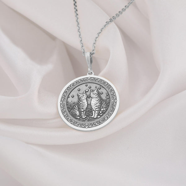 925 Sterling Silver Twin Cats Medallion showcasing beloved bonded feline pair under celestial stars. Detailed memorial coin pendant with sibling cats and ornate border. Premium cat loss jewelry symbolizing eternal love and connection.