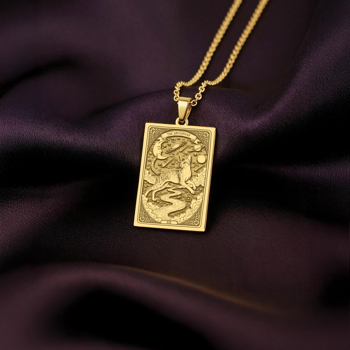 An heirloom-quality 14K solid gold Portuguese Water Dog tarot pendant. The art shows the dog on a river path, symbolizing adventure, a precious dog mom gift.