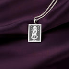 A personalized 925 sterling silver Pomeranian Boo necklace. This gift celebrates the whimsical spirit of the Pom, a cherished pet memorial keepsake.