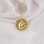 14K Solid Gold Panacea Goddess Medallion Pendant featuring Greek healing deity with medicinal bowl. Ancient medicine symbol with detailed floral wreath border. Luxury wellness jewelry gift with healing symbolism and intricate botanical elements.