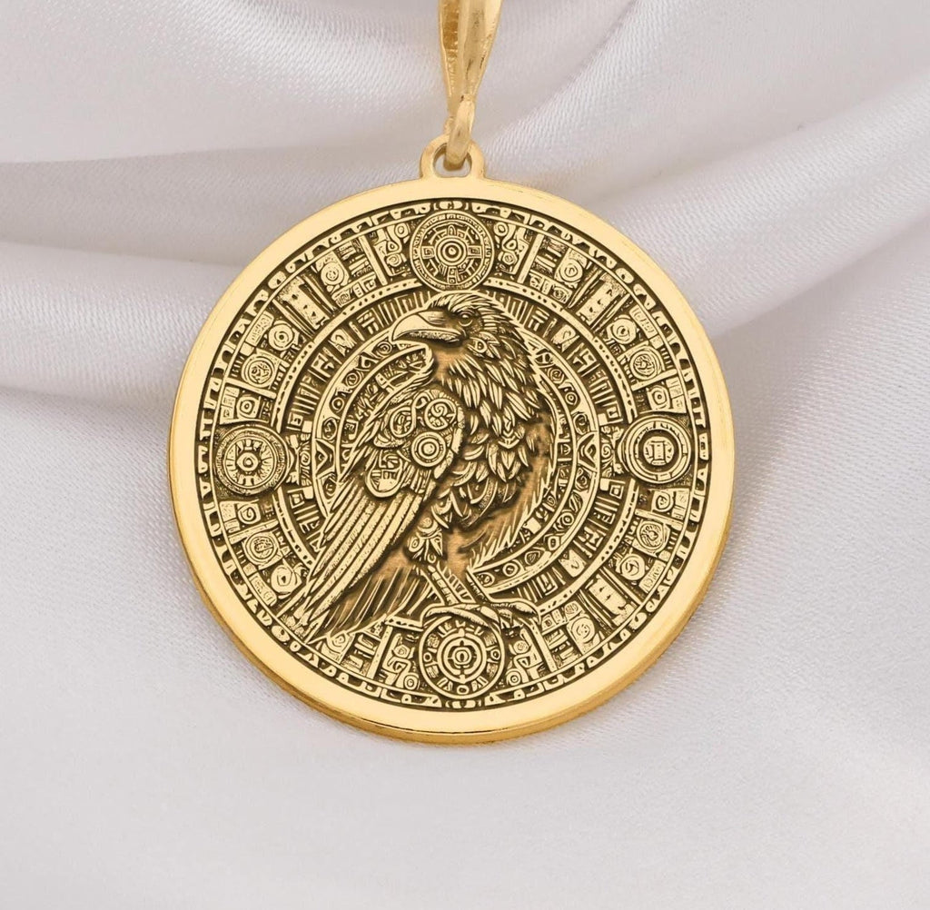 14K Gold Raven Pendant Necklace with intricate Aztec calendar design, perfect for mythology lovers. Ideal gift for anniversaries, birthdays, or special occasions. A timeless gold piece blending cultural symbolism and style.