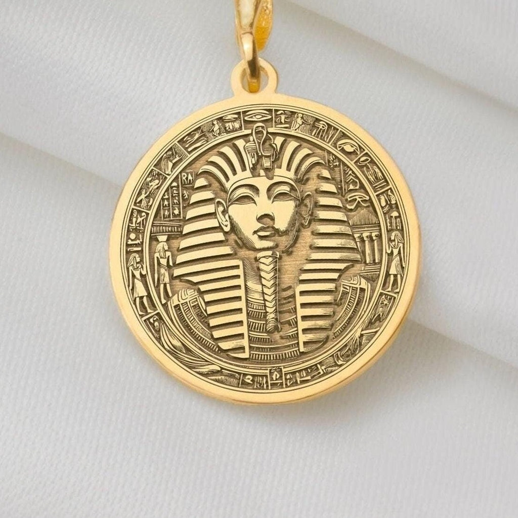 Yellow gold Tutankhamun coin pendant necklace, inspired by ancient Egypt. This dainty 14k gold charm symbolizes royalty and resilience, perfect for layering or daily wear. A unique, lightweight gift blending timeless elegance and boho style.