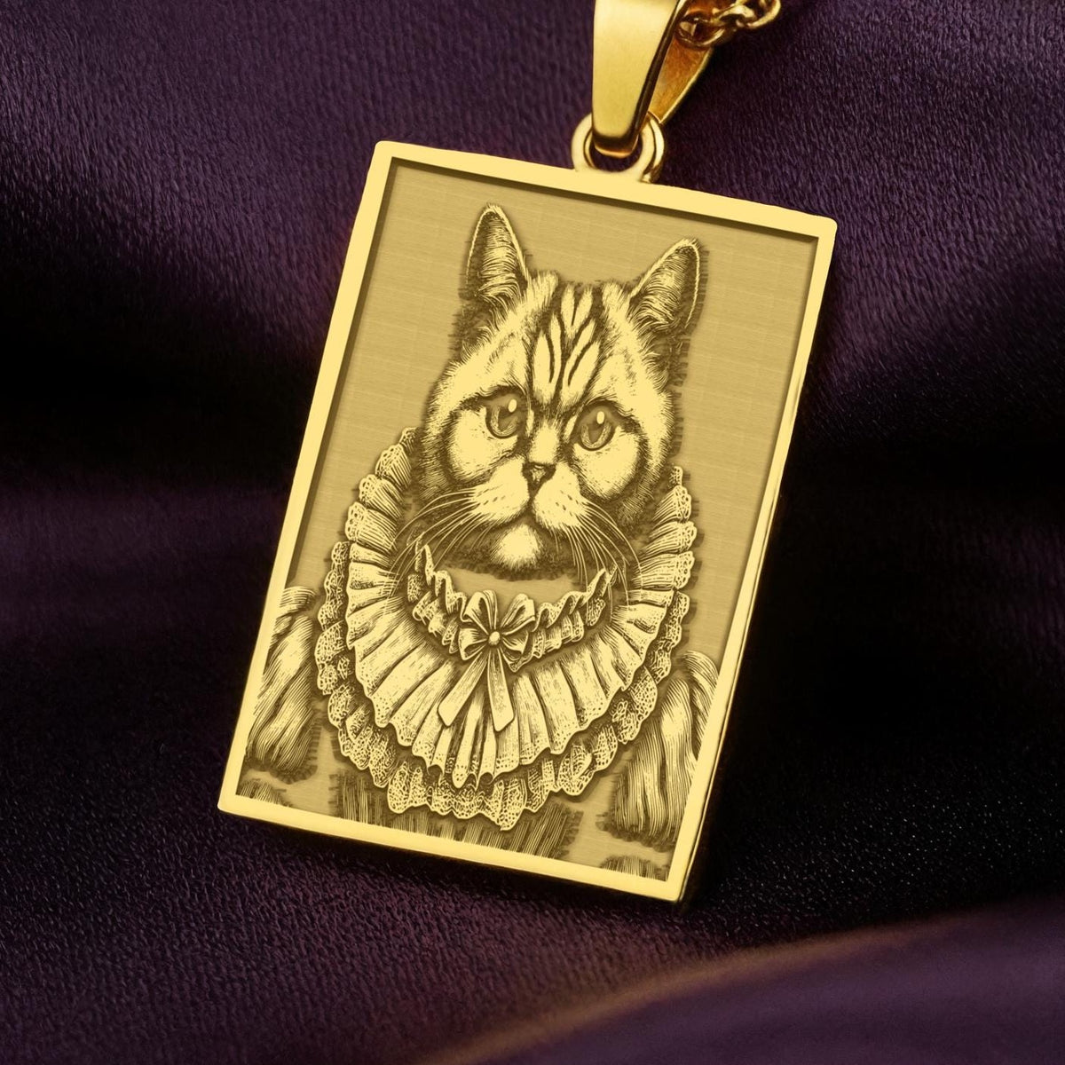 Close up of the 14K Solid Gold British Shorthair pendant showing the intricate engraving details of the noble cat in Victorian attire.