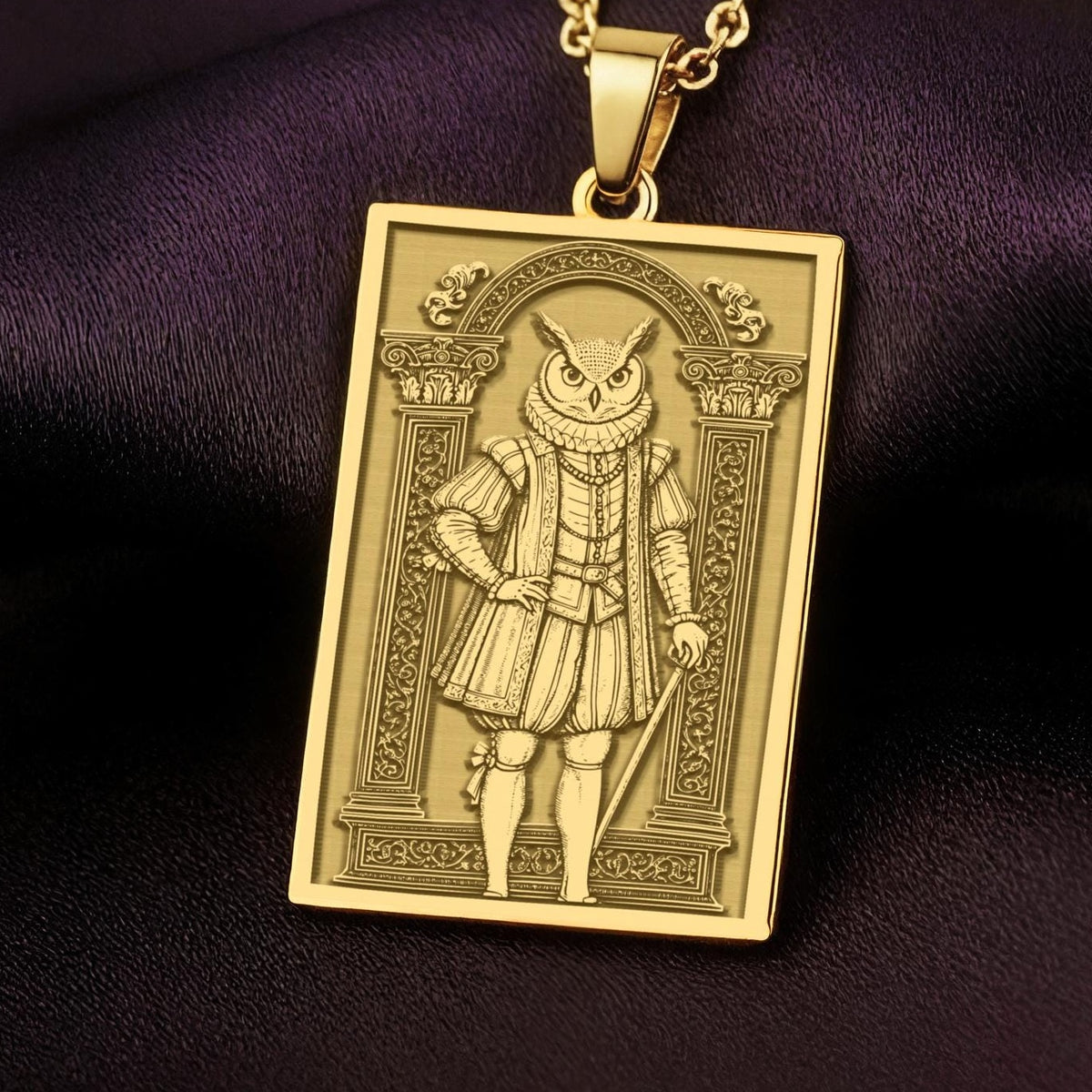 A handmade 14K gold plated rectangular necklace with a highly detailed engraving of a wise owl man. The anthropomorphic art shows a fable character in classic Elizabethan attire.