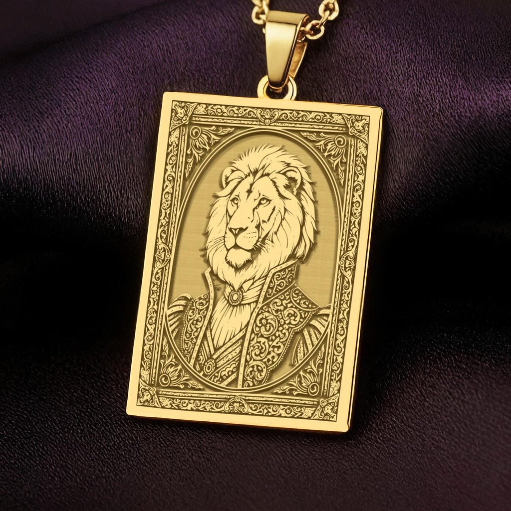 A handmade 14K gold plated rectangular necklace with a highly detailed engraving of a regal lion man. The anthropomorphic art shows a fable character, the King of Beasts, in ornate attire.