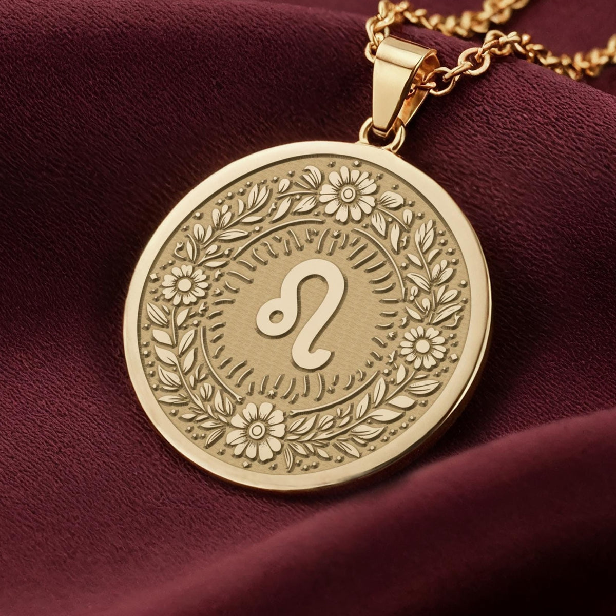 Leo Zodiac Astrological Sign Medallion Necklaces 14K 14K Gold Plated pendant necklace featuring an ornate circular design with floral engravings and a stylized infinity loop.