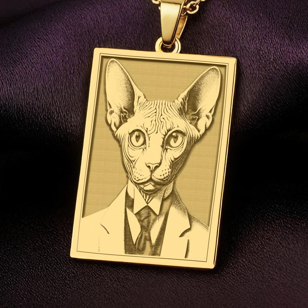 A rectangular 14K gold plated pendant necklace with a detailed laser engraving of a Sphynx cat wearing a Victorian suit and tie.