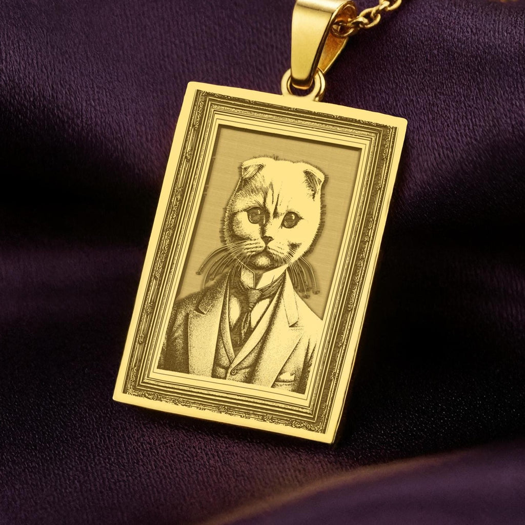 Product photo of a 14K Solid Gold Scottish Fold necklace from the 'Victorian Pet Collection'. The engraved cat is portrayed as a dapper gentleman in a suit and tie.