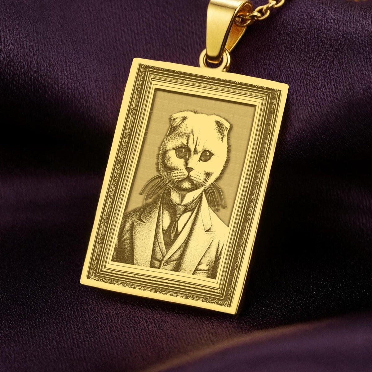 Product photo of a 14K Solid Gold Scottish Fold necklace from the 'Victorian Pet Collection'. The engraved cat is portrayed as a dapper gentleman in a suit and tie.