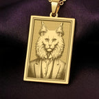 14K Solid Gold Turkish Angora necklace from The Ancestors Collection, featuring an engraved portrait of a dapper cat in a vintage suit on a dark purple background.