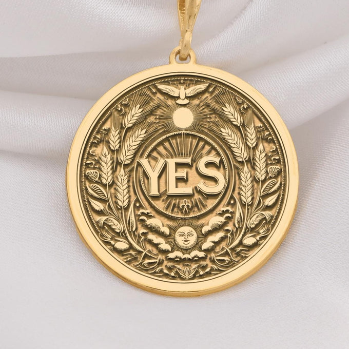 14K Solid Gold YES Medallion featuring powerful affirmation surrounded by wheat laurels and celestial motifs. Detailed empowerment talisman with sun, moon, bird and botanical symbols.Symbolizing positive decisions and abundant manifestation.