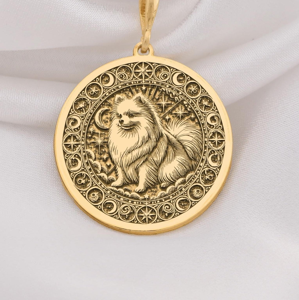 a gold necklace with a picture of a dog on it