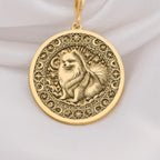 a gold necklace with a picture of a dog on it