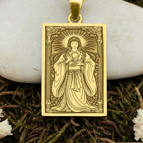 An heirloom-quality 14K solid gold rectangular pendant engraved with the powerful sun goddess, Amaterasu. This fine jewelry piece, a symbol of light and harmony, is a sacred tribute to the divine feminine.