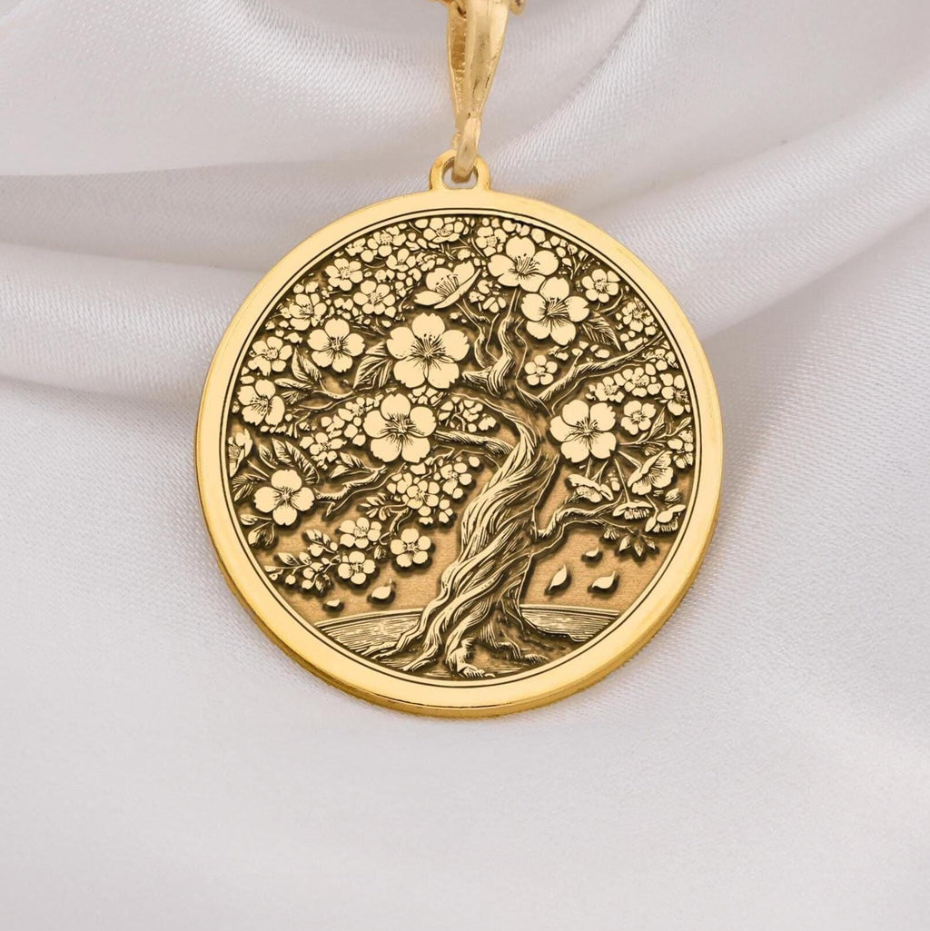 14K Gold Sakura Tree Pendant featuring a cherry blossom design, symbolizing renewal and beauty. Perfect for nature lovers and gift giving occasions.