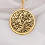 14K Gold Sakura Tree Pendant featuring a cherry blossom design, symbolizing renewal and beauty. Perfect for nature lovers and gift giving occasions.