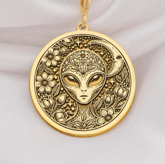 Mystical 14K gold alien pendant, featuring a detailed extraterrestrial medallion with floral cosmic engravings. A stunning sci-fi jewelry piece, perfect for space lovers, making it a unique gold cosmic charm.
