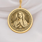 14K Solid Gold Queen of Peace necklace featuring Virgin Mary with halo and praying hands. A sacred and elegant Catholic gold medallion.