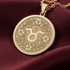 14K Solid Gold Taurus Zodiac Medallion with Taurus symbol (♉) and floral wreath. A perfect personalized gift with optional back engraving. Detailed celestial horoscope jewelry for astrology lovers.