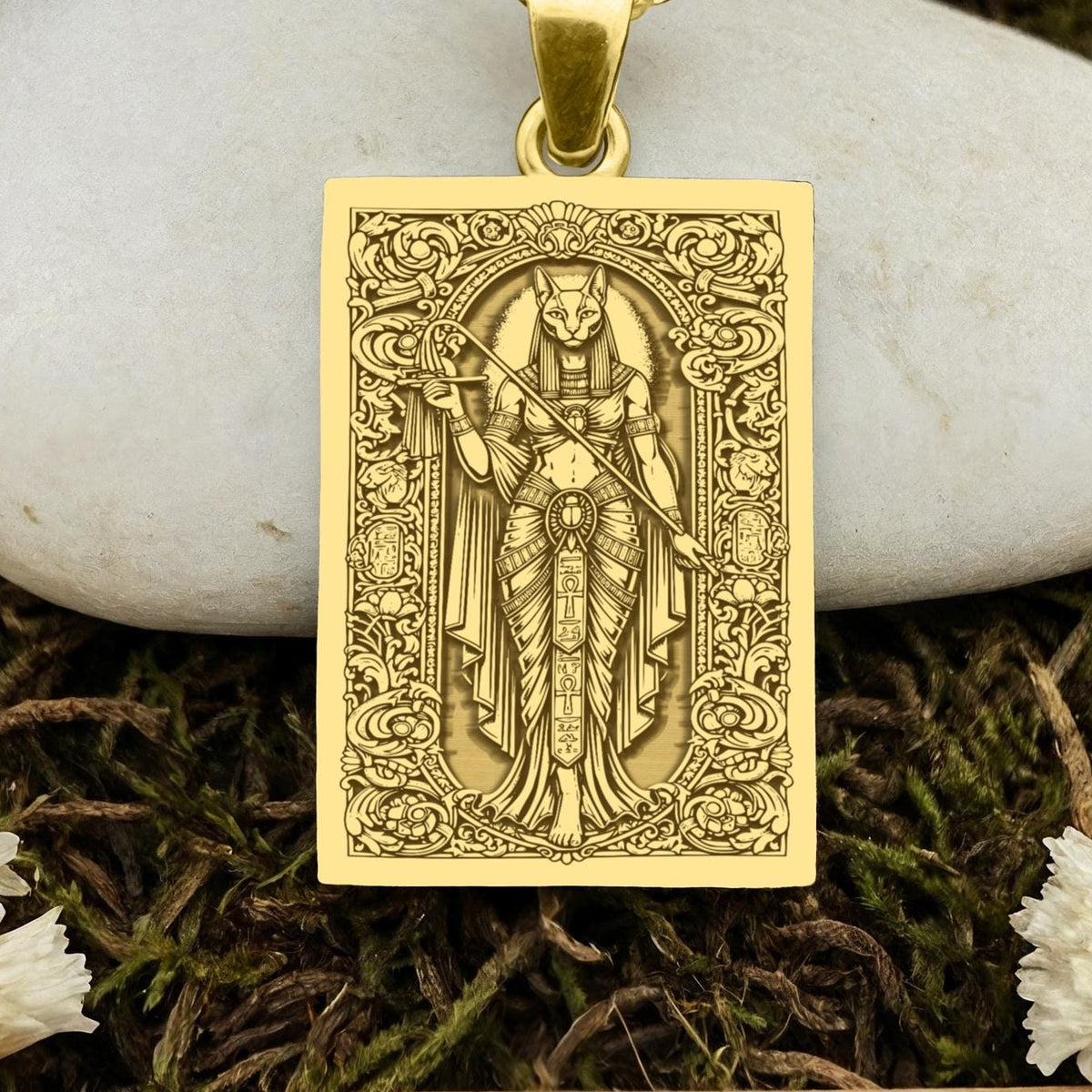 An heirloom-quality 14K solid gold tarot card amulet depicting the Goddess Bastet. This fine engraved jewelry is a sacred Kemetic paganism symbol.