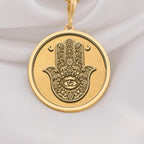 Hamsa pendant in 14K Solid Gold featuring the Evil Eye symbol, representing spiritual protection and good fortune. Ideal gold necklace for gifting or everyday wear with a bohemian touch.